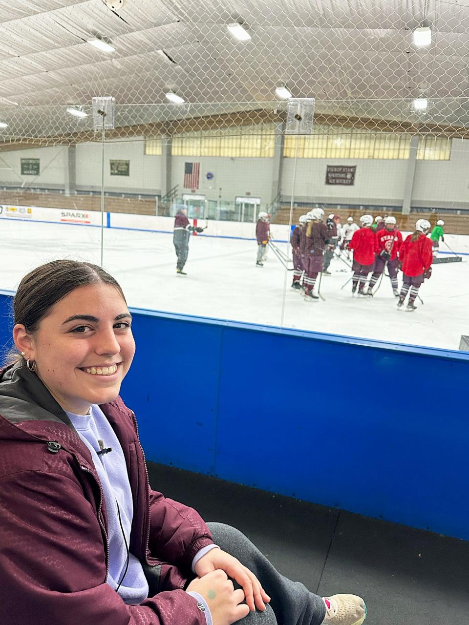 Durfee three-sport athlete and Bishop Stang ice hockey player Emily Curran watches a recent practice at Hetland Ice Arena in New Bedford.