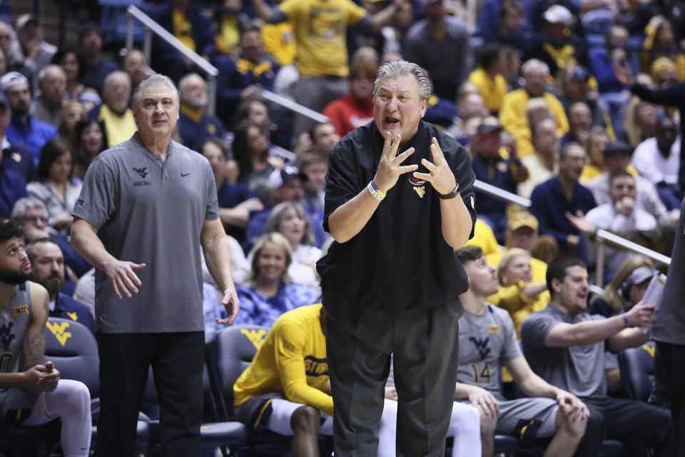 West Virginia coach Bob Huggins reacts during the first half of an NCAA college basketball game against Baylor Saturday, March 7, 2020, in Morgantown, W.Va. (AP Photo/Kathleen Batten)