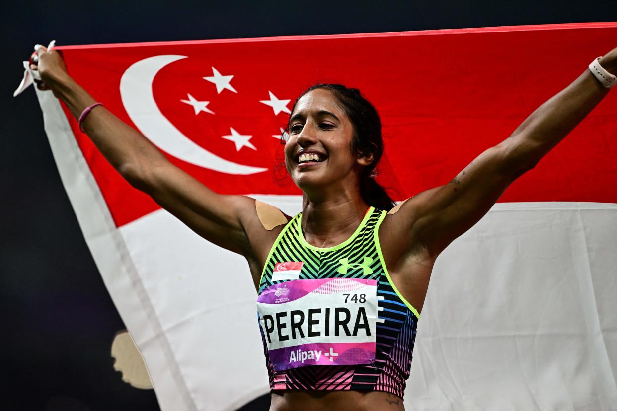 Singapore's Shanti Pereira celebrates after earning a silver medal in the women's 100m final at the 2023 Hangzhou Asian Games. 