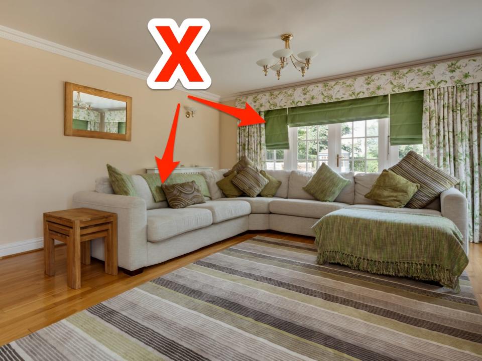 red x and arrows pointing at coordinated green decor items in a homey living room