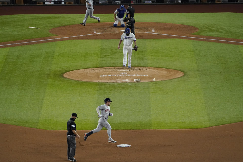 Houston Astros' Alex Bregman (2) rounds second base after hitting a two-run home run off Texas Rangers' pitcher Lance Lynn in the fifth inning of a baseball game in Arlington, Texas, Thursday, Sept. 24, 2020. (AP Photo/Tony Gutierrez)