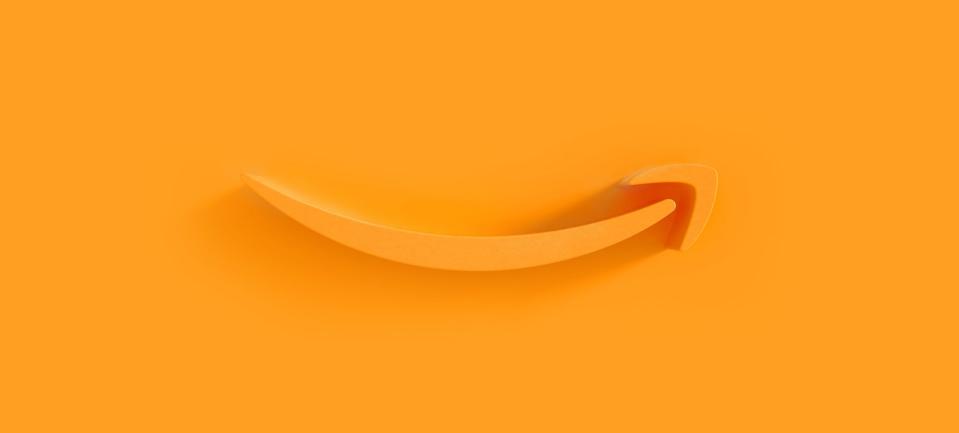 Amazon's smile logo rendered in 3D on orange background.