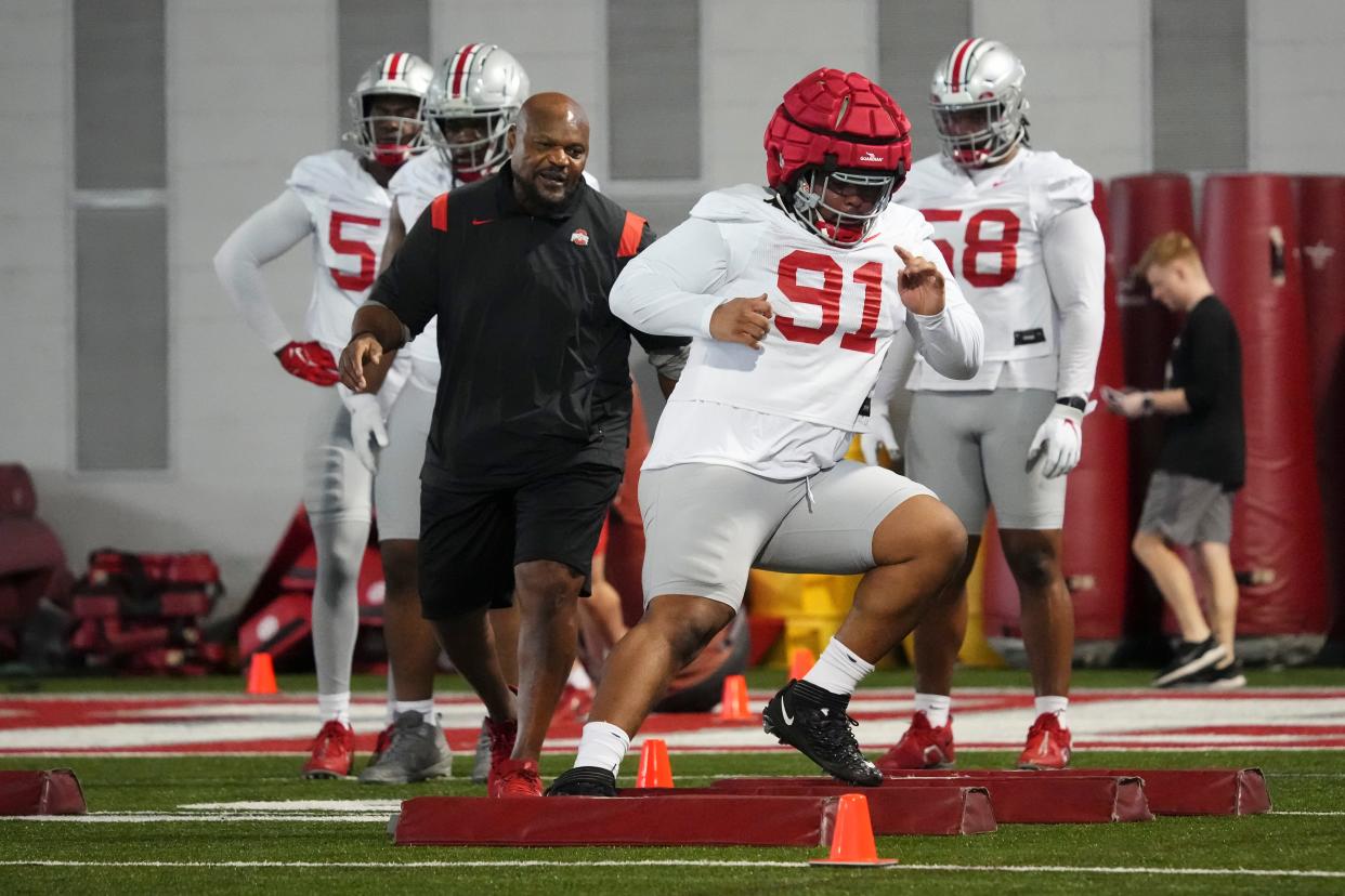 Mar 5, 2024; Columbus, OH, USA; Defensive line coach Larry Johnson watches as defensive lineman Tyleik Williams (91) runs during the first spring practice at the Woody Hayes Athletic Center.