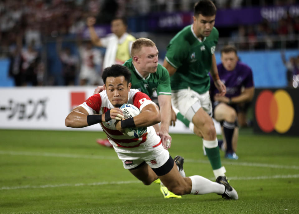 Japan's Kenki Fukuoka scores a try during the Rugby World Cup Pool A game at Shizuoka Stadium Ecopa between Japan and Ireland in Shizuoka, Japan, Saturday, Sept. 28, 2019. (AP Photo/Jae Hong)