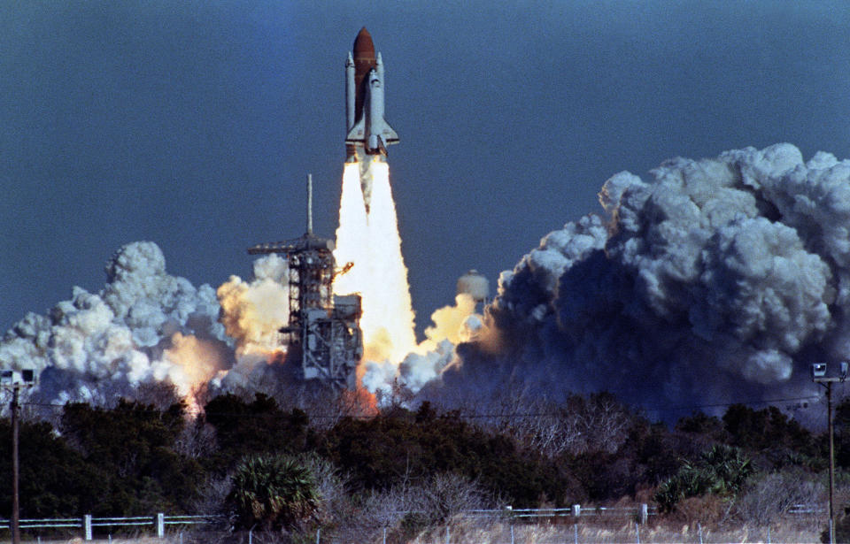 US space shuttle Challenger lifts off 28 January 1986 from a launch pad at Kennedy Space Center, 72 seconds before its explosion killing it crew of seven. Challenger was 72 seconds into its flight, travelling at nearly 2,000 mph at a height of ten miles, when it was suddenly envelope in a red, orange and white fireball as thousands of tons of liquid hydrogen and oxygen fuel exploded. AFP PHOTO NASA         (Photo credit should read BOB PEARSON/AFP via Getty Images)