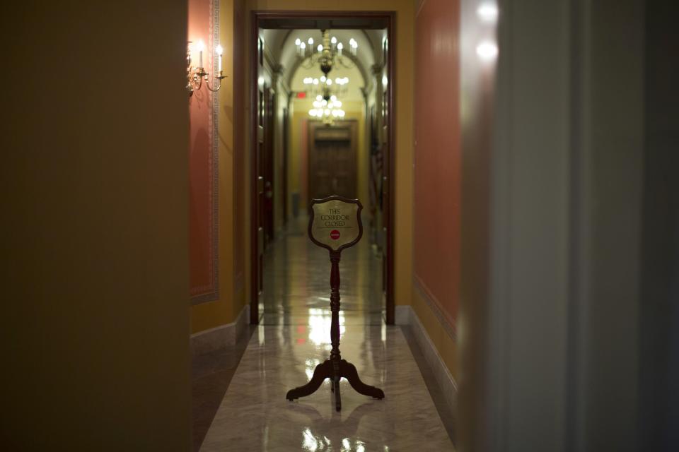 A sign in an empty corridor leading to the offices of Republican House leadership is pictured on Capitol Hill in Washington October 9, 2013. Republicans and Democrats in Congress saw signs of hope on Wednesday for a break in their fiscal impasse, as members of both parties floated the possibility of a short-term increase in the debt limit to allow time for broader negotiations on the budget. (REUTERS/Jason Reed)