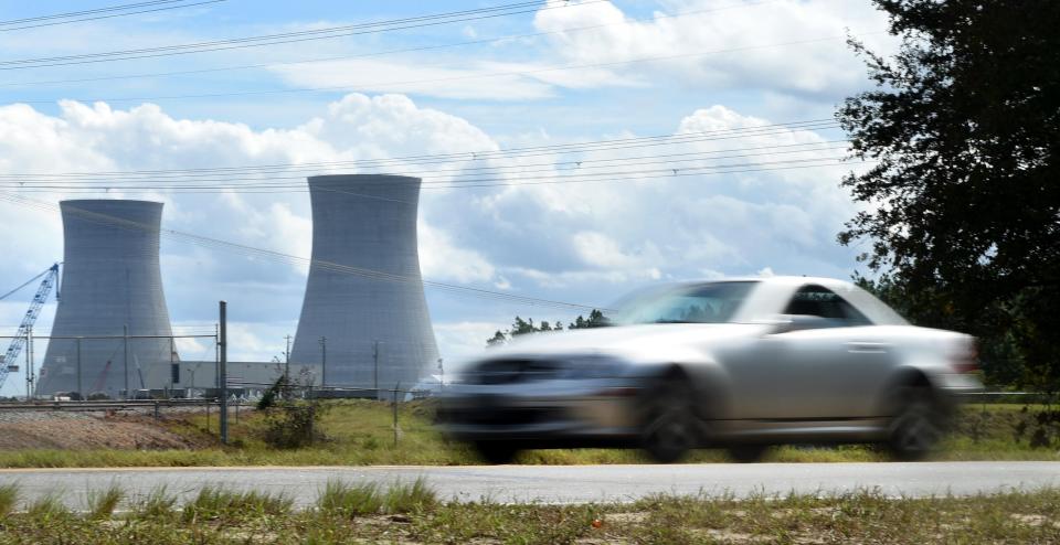 FILE - A car passes by Plant Vogtle on River Road. Georgia Power reported that fuel loading began at Plant Vogtle's Unit 3 reactor near Waynesboro on Friday, Oct. 14, 2022.