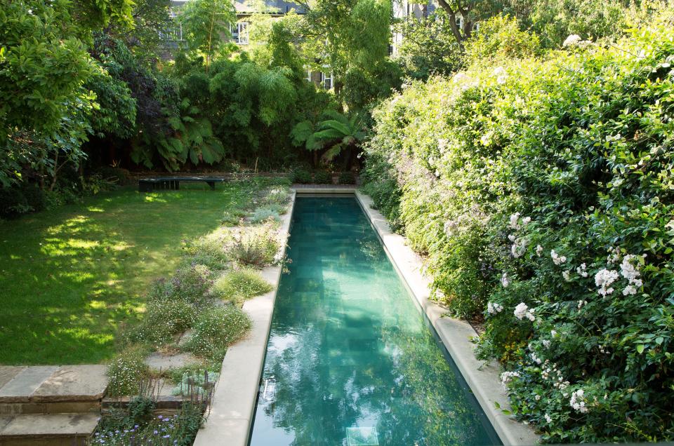 The stone-edged lap pool was designed by Yovanovitch; Landscaping by Ceri Evans for The Natural Gardening Co.