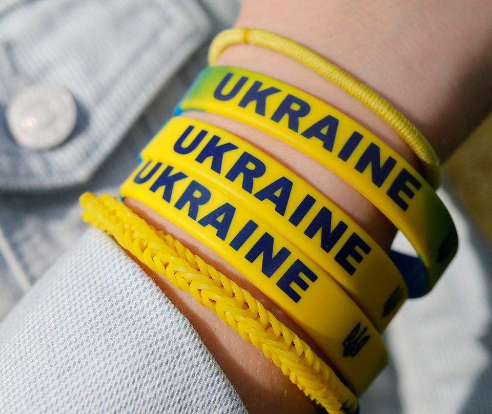 Pembroke fifth graders Madeline Rejewski and Violet Carson both 11 with some "Ukraine" bracelets they plan on selling with profits going the embattled country on Thursday May 5, 2022   