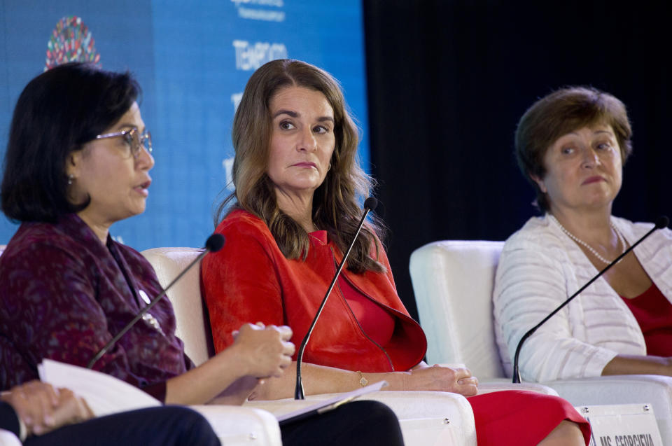 FILE - In this Thursday, Oct. 11, 2018, file photo, Co-Chair of the Bill and Melinda Gates Foundation, Melinda Gates, center, sits on a panel with Indonesia's Finance Minister Sri Mulyani Indrawati, left, and Chief Executive Officer of the World Bank Kristalina Georgieva, right, during a seminar ahead of the annual meetings of the IMF and World Bank in Bali, Indonesia. An international push is underway to help ensure that the digital industrial revolution will help replace jobs lost to robots and artificial intelligence with better opportunities. Melinda Gates said in a recent interview with The Associated Press the aim of the Pathways for Prosperity initiative, which is backed by the Bill and Melinda Gates Foundation, is to help create new jobs and communities by ensuring everyone has access to the internet and the ability to use it. (AP Photo/Firdia Lisnawati, File)