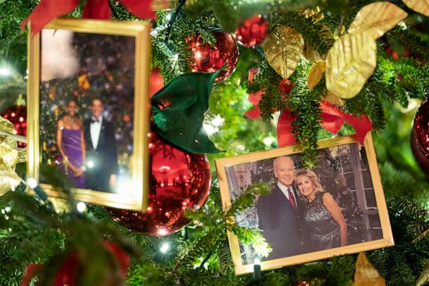 PHOTO: A photo of President Joe Biden and first lady Jill Biden rests in a Christmas tree in the State Dining Room of the White House during a press preview of the White House holiday decorations, Nov. 29, 2021, in Washington. (Evan Vucci/AP)