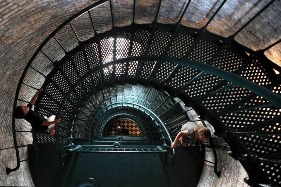 Visitors ascend the steps of the Currituck Beach Lighthouse in Corolla, N.C.