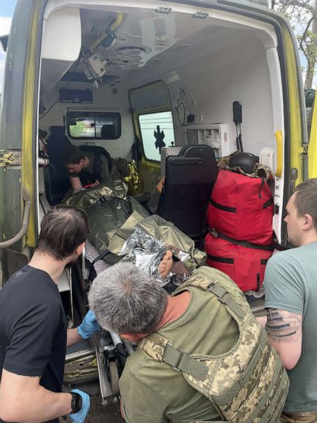 PHOTO: A soldier with heavy shrapnel wound to his leg is loaded into an ambulance before being driven away to a more significant medical facility for further treatment. (ABC News)