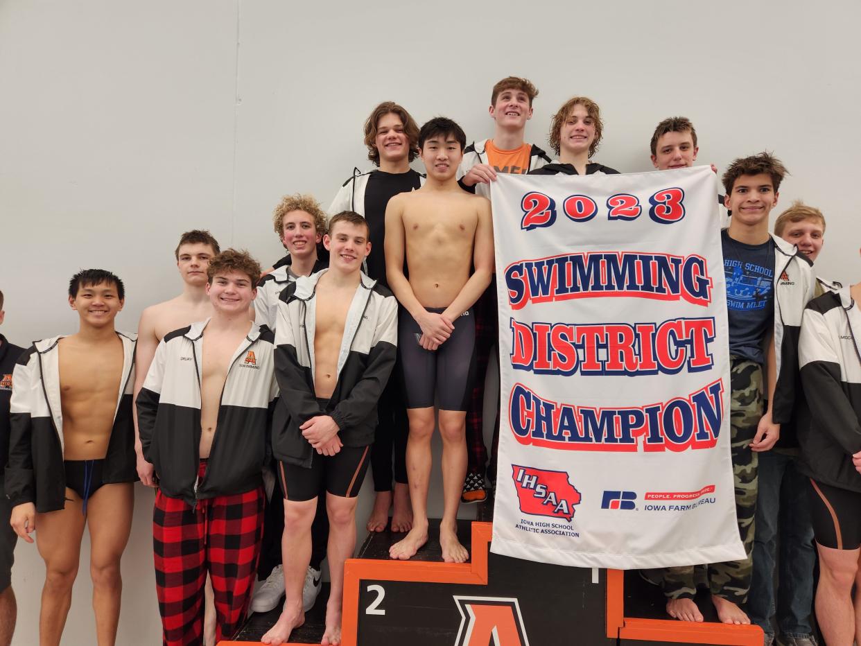 The Ames boys swimming team celebrates its 2023 district championship following its victory at the district meet held at Dan Flannery Pool in Ames Saturday. The Little Cyclones qualified for state in all 11 events.