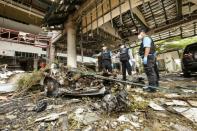 A forensics unit inspects the site of a deadly bomb blast outside a hotel in the southern province of Pattani on August 24, 2016