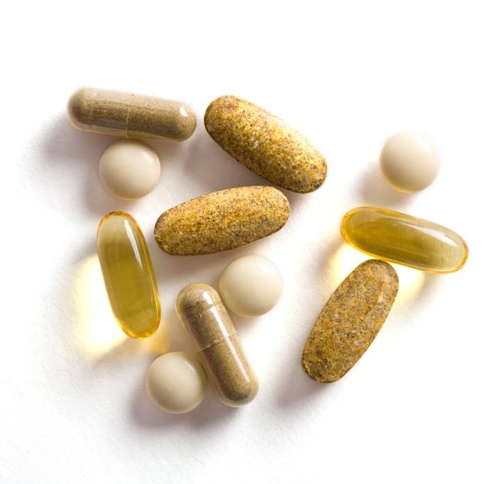 A variety of vitamins and supplements on a white surface