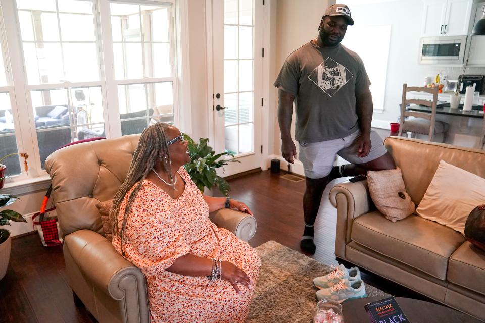 Cincinnati Bengals defensive tackle DJ Reader talks with his mother, Felicia, in the living room of her home, Friday, June 16, 2023, in Greensboro, N.C.