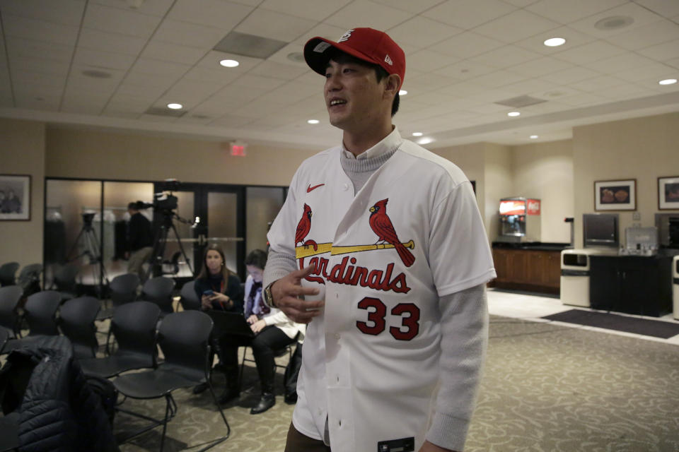 St. Louis Cardinals pitcher Kwang-Hyun Kim wears his new Cardinals baseball jersey following a news conference Tuesday, Dec. 17, 2019, in St. Louis. The Cardinals have signed the Korean left-hander to a two-year contract. (AP Photo/Jeff Roberson)