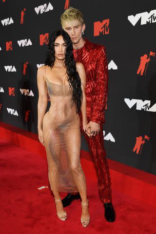 <p>Kevin Mazur/MTV VMAs 2021/Getty</p> Megan Fox and Machine Gun Kelly attend the 2021 MTV Video Music Awards