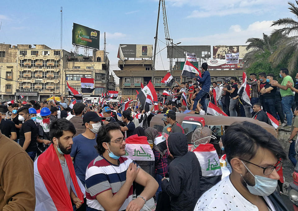 Anti-government protesters gather in Tahrir Square during ongoing protests in Baghdad, Iraq, Wednesday, Oct. 30, 2019. (AP Photo/Khalid Mohammed)