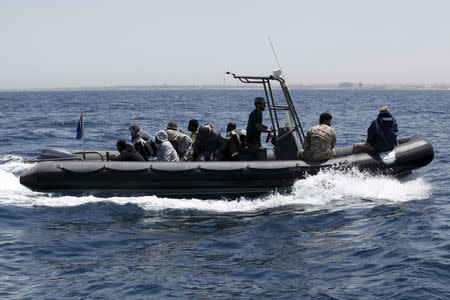 Libyan Navy boat carries illegal migrants who attempted to flee the coast to Europe back to the coastal city of Tripoli May 5, 2015. REUTERS/Ismail Zitouny