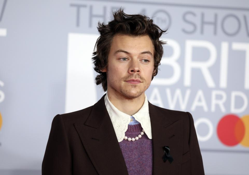 Harry Styles poses for photographers upon arrival at Brit Awards 2020 in London, Tuesday, Feb. 18, 2020.(Photo by Vianney Le Caer/Invision/AP)