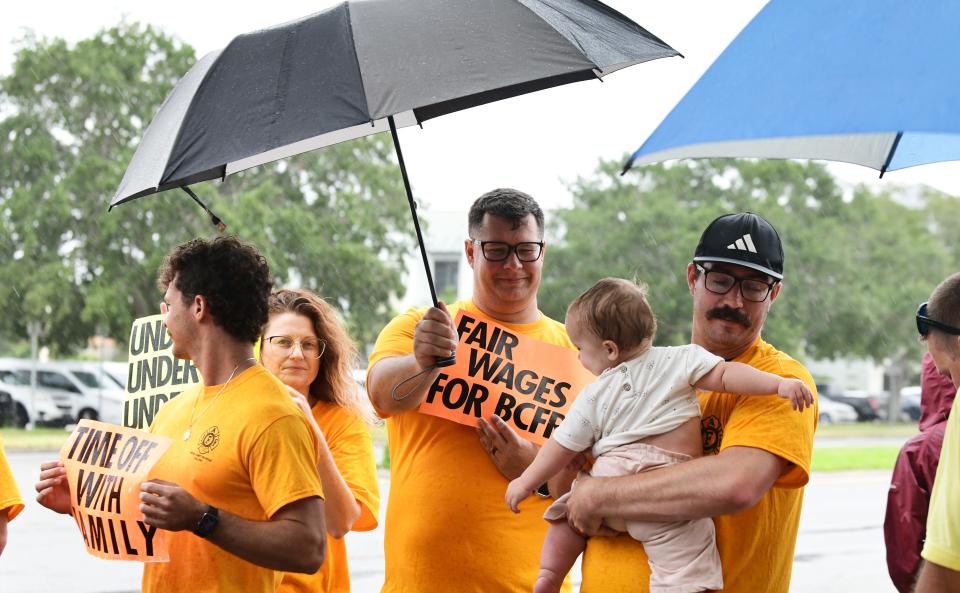 Brevard County Fire Rescue union members and their supporters participate in a rally for better pay before a recent Brevard County Commission meeting. TIM SHORTT/FLORIDA TODAY