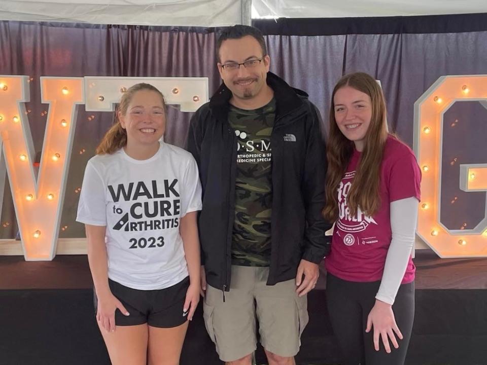 Mira Leurquin stands with Dr. Tuttle at the 2023 Walk to Cure Arthritis event in Green Bay.