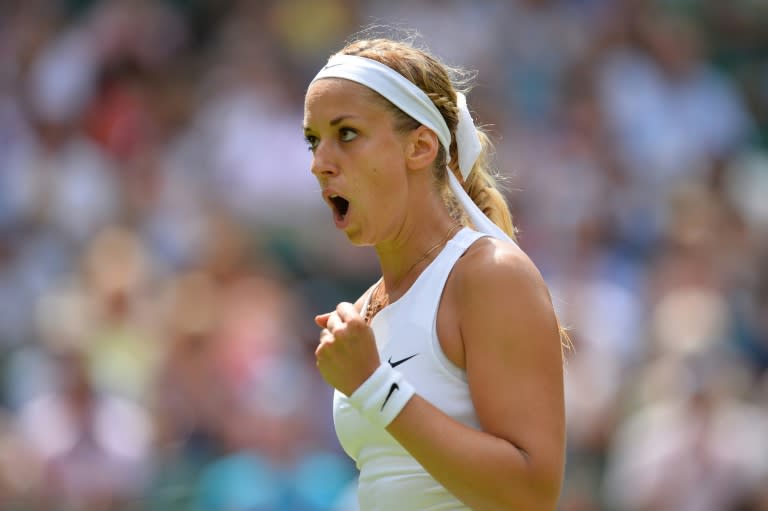 Germany's Sabine Lisicki reacts after a point against US player Christina McHale during their women's singles second round match on day four of the 2015 Wimbledon Championships in Wimbledon, southwest London, on July 2, 2015