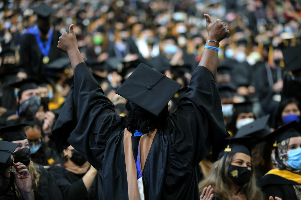 Boston, MA - August 26: An graduating army veteran, center, is recognized for her service during the 53rd Commencements of the University of Massachusetts Boston at TD Garden in Boston, MA on August 26, 2021. UMass Boston held two ceremonies to celebrate the Class of 2021 and also the Class of 2020, which didn't have a traditional in-person graduation due to the COVID-19 pandemic. (Photo by Craig F. Walker/The Boston Globe via Getty Images)