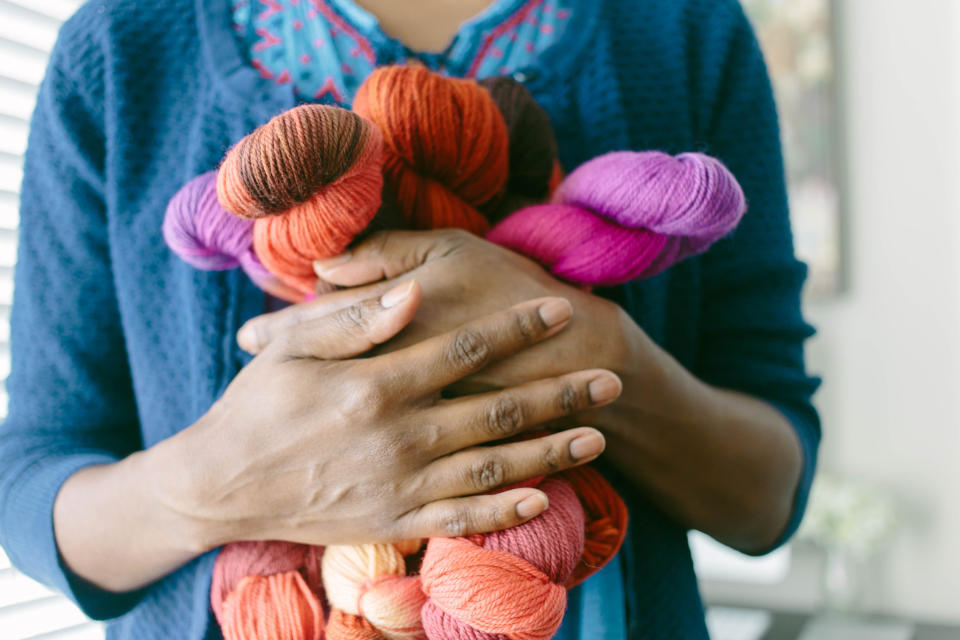 a person holding yarn