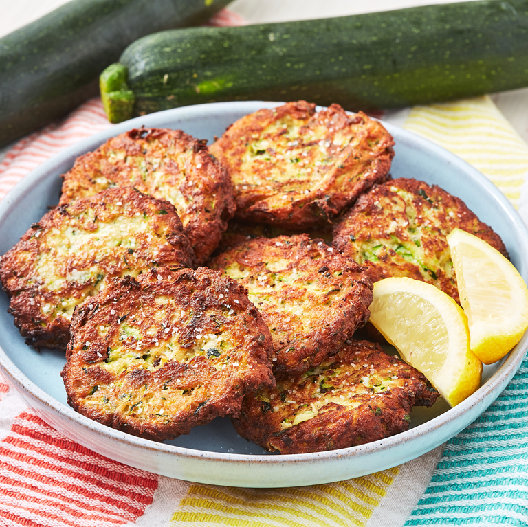 <p>Also known as <a href="https://www.delish.com/uk/cooking/recipes/g28961915/courgette-recipes/" rel="nofollow noopener" target="_blank" data-ylk="slk:courgette;elm:context_link;itc:0;sec:content-canvas" class="link ">courgette</a> fritters, these easy courgette cakes are a summertime favourite. They're the perfect way to use up an abundance of courgette, along with making <a href="https://www.delish.com/uk/cooking/recipes/a28961505/zucchini-chocolate-chip-cookies-recipe/" rel="nofollow noopener" target="_blank" data-ylk="slk:Courgette Chocolate Chip Cookies;elm:context_link;itc:0;sec:content-canvas" class="link ">Courgette Chocolate Chip Cookies</a>, of course. These simple fritters are quickly shallow-fried and make a great side dish for dinner or a light lunch. They can even be easily adapted to fit whatever you're looking for! </p><p>Get the <a href="https://www.delish.com/uk/cooking/recipes/a32954264/easy-zucchini-cakes-recipe/" rel="nofollow noopener" target="_blank" data-ylk="slk:Courgette Cakes;elm:context_link;itc:0;sec:content-canvas" class="link ">Courgette Cakes</a> recipe.</p>