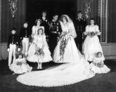 <p>Princess Diana and her new husband, Prince Charles, pose for photos with family in the Throne Room, following their wedding ceremony.</p>