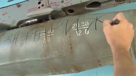 Handout of a still image taken from video footage, released by Russia's Defence Ministry on November 20, 2015, shows a ground crew member writing the words "For Paris" on a bomb on a Russian military jet at the Hmeymim air base near Latakia, Syria. REUTERS/Ministry of Defence of the Russian Federation/Handout via Reuters ATTENTION EDITORS - THIS IMAGE WAS PROVIDED BY A THIRD PARTY. REUTERS IS UNABLE TO INDEPENDENTLY VERIFY THE AUTHENTICITY, CONTENT, LOCATION OR DATE OF THIS IMAGE. FOR EDITORIAL USE ONLY. NOT FOR SALE FOR MARKETING OR ADVERTISING CAMPAIGNS. FOR EDITORIAL USE ONLY. NO RESALES. NO ARCHIVE. THIS IMAGE HAS BEEN SUPPLIED BY A THIRD PARTY. IT IS DISTRIBUTED, EXACTLY AS RECEIVED BY REUTERS, AS A SERVICE TO CLIENTS.