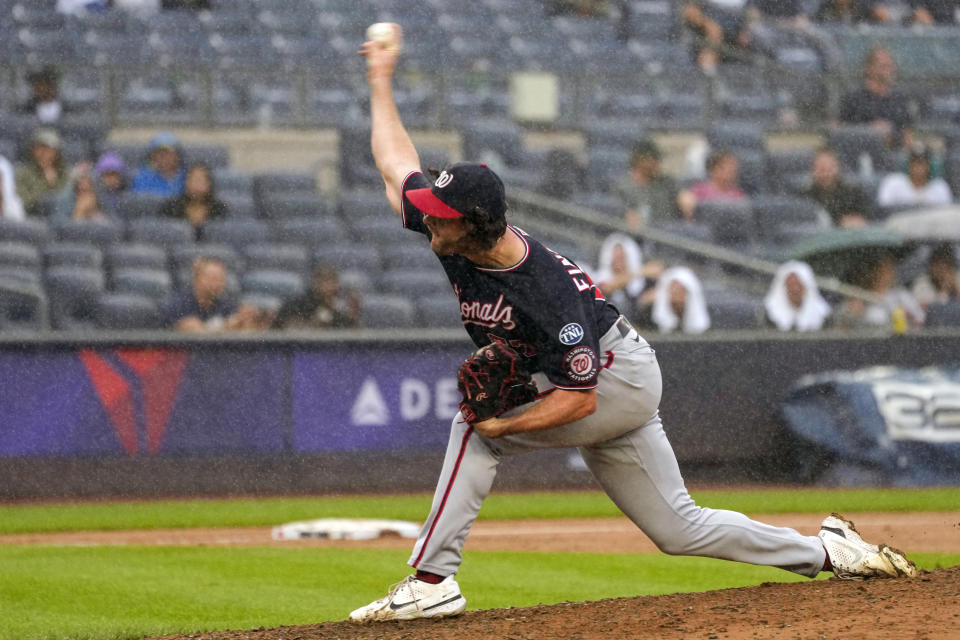 Washington Nationals relief pitcher Kyle Finnegan delivers in the rain against the New York Yankees in the ninth inning of a baseball game, Thursday, Aug. 24, 2023, in New York. (AP Photo/Mary Altaffer)
