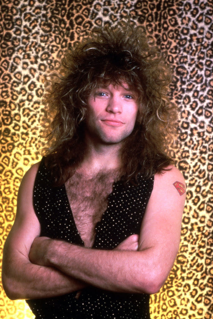 Jon Bon Jovi posing for a portrait in 1987 with leopard backdrop