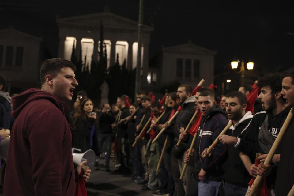 Protesters take part in a rally against police in Athens, Greece, Tuesday, Dec. 13, 2022. Leaders of the Roma community in northern Greece have appealed for calm as student and anarchist groups called rallies to protest the death Tuesday of a Roma teenager. The 16-year-old had been shot in the head during a police chase last week over an allegedly unpaid gas station bill. (AP Photo/Yorgos Karahalis)