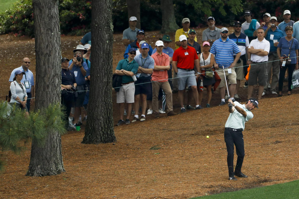 Bubba Watson hits off of the pine straw on the ninth hole during a practice round for the Masters golf tournament Tuesday, April 9, 2019, in Augusta, Ga. (AP Photo/Matt Slocum)
