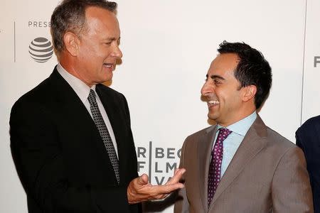 Actors Amir Talai (R) and Tom Hanks arrive for 'The Circle' premiere at the Tribeca Film Festival in the Manhattan borough of New York, New York, U.S. April 26, 2017. REUTERS/Carlo Allegri