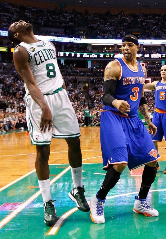 Jeff Green (L) of the Boston Celtics reacts after losing the ball in front of Kenyon Martin of the New York Knicks on April 26, 2013. New York led by 16 points at halftime and were never seriously challenged after the break