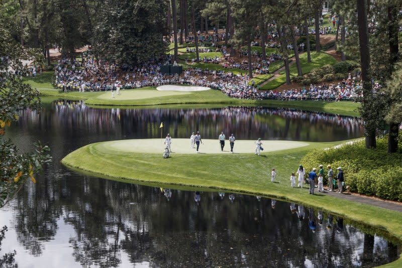 Golfers walk off the green on hole No. 8 during the Par 3 Contest at the 2024 Masters Tournament on Wednesday at Augusta National Golf Club in Augusta, Ga. Photo by Tannen Maury/UPI