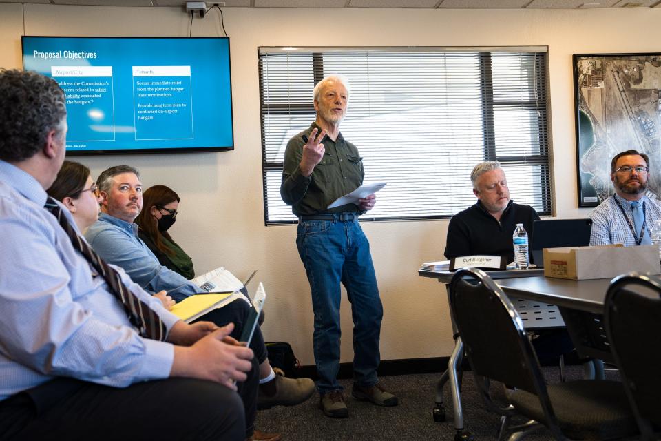 Rick Turley presents a proposal by private aircraft owners to keep their planes in their hangars to the Northern Colorado Regional Airport Commission on Thursday at the airport in Loveland.