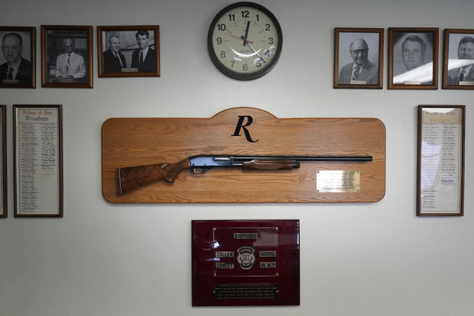 A shotgun made by Remington Arms, gifted by the company to the town, hangs on the wall of the municipal building in Ilion, N.Y., Thursday, Feb. 1, 2024. The nation’s oldest gun-maker is consolidating operations in Georgia and recently announced plans to shutter the Ilion factory in early March. (AP Photo/Seth Wenig)