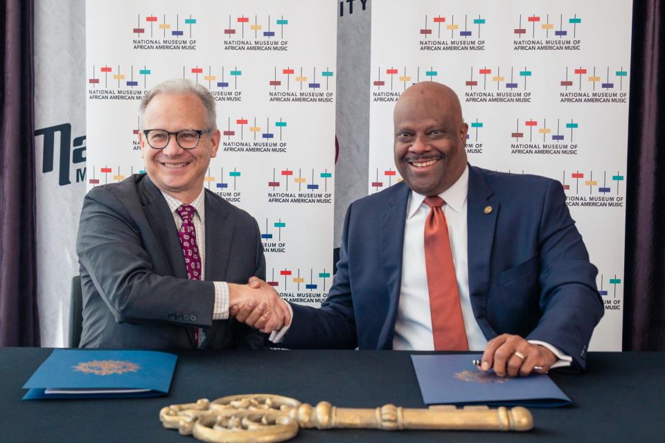 Nashville Mayor David Briley and National Museum of African American Music President and CEO H. Beecher Hicks III shake hands Aug. 29, 2019. Briley and Hicks signed a lease officially granting the museum control over its space in the Fifth + Broadway commercial development.