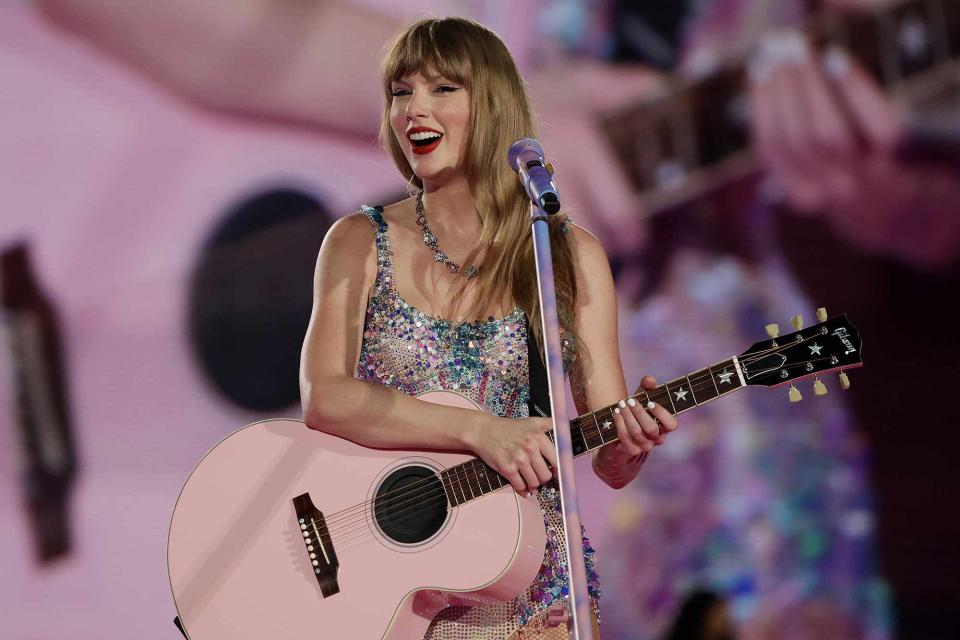 <p>Ashok Kumar/TAS24/Getty</p> Taylor Swift performs in Singapore in March 2024