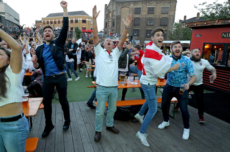 Fans celebrate at the Vinegar Yard in London after England opened the scoring. 