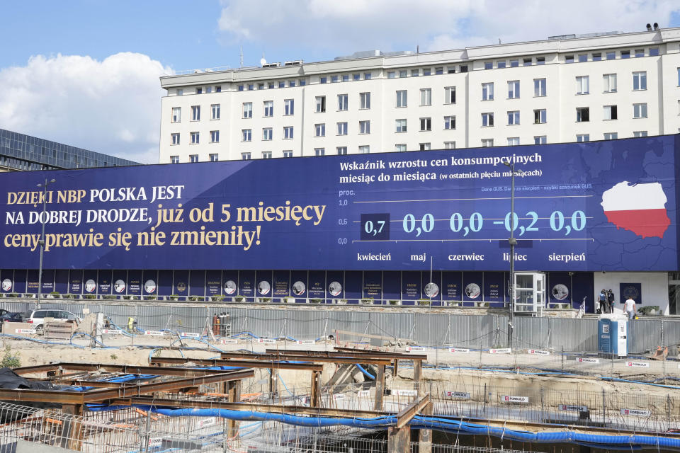 A banner on the building of the National Bank of Poland says 'Thanks to the NBP (National Bank of Poland) Poland is on a good path, for 5 months already prices have hardly changed!' in Warsaw, Poland, on Thursday Sept. 7, 2023. The banner also shows the month-on-month increase in prices from April to August. The head of the bank, Adam Glapinski, said Thursday that the bank's large interest rate cut this week was justified because prices are stabilizing and an era of high inflation is ending. Poland's inflation rate was 10.1% in August. Central banks tend to raise interest rates, not cut them, amid high inflation, and both cut and Glapinski's comments caused the zloty currency to fall against other currencies. (AP Photo/Czarek Sokolowski)