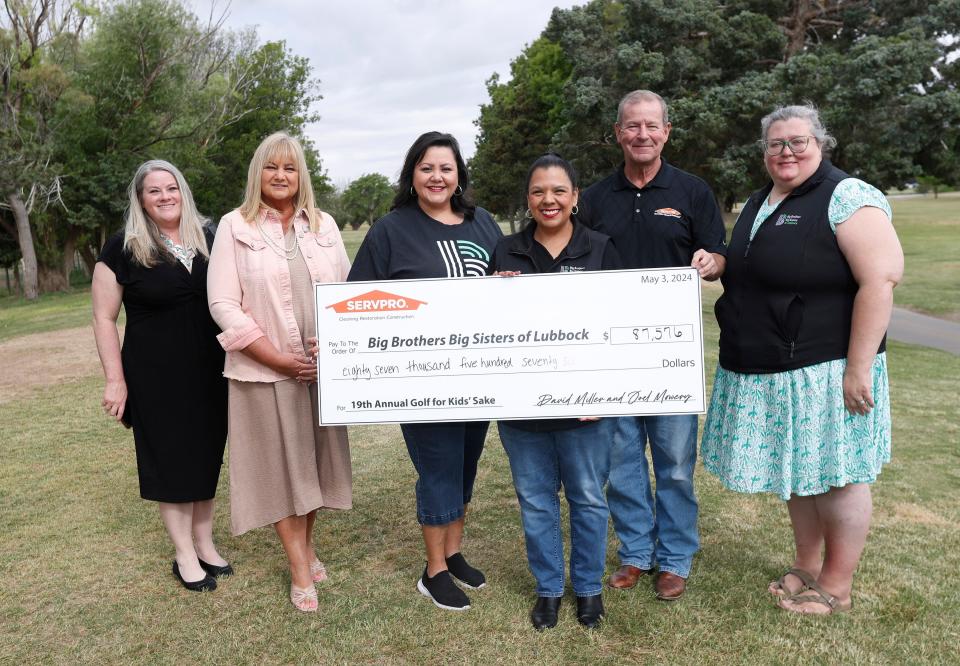 From left, Razonia McClellan, Ramona McKay, Debra Gonzales, Melissa Corley, and Joel Mowery and Leia Arteaga represent the 19th Annual Golf for Kid’s Sake tournament that was held May 3 at LakeRidge Country Club.