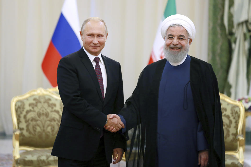 Iran's President Hassan Rouhani, right, shakes hands with Russia's President Vladimir Putin, in Tehran, Iran, Friday, after their talks, part of Russia-Iran-Turkey summit to discuss Syria, Friday Sept. 7, 2018. Putin, Erdogan and Iran's President Hassan Rouhani began a meeting Friday in Tehran to discuss the war in Syria, with all eyes on a possible military offensive to retake the last rebel-held bastion of Idlib. (AP Photo/Ebrahim Noroozi)