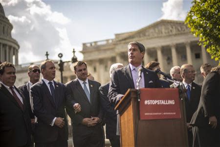 Sen. David Vitter (R-LA) speaks to reporters outside the Capitol about the government shutdown in Washington October 1, 2013. Up to one million federal workers were thrown temporarily out of work on Tuesday as the U.S. government partially shut down for the first time in 17 years in a standoff between President Barack Obama and congressional Republicans over healthcare reforms. REUTERS/James Lawler Duggan